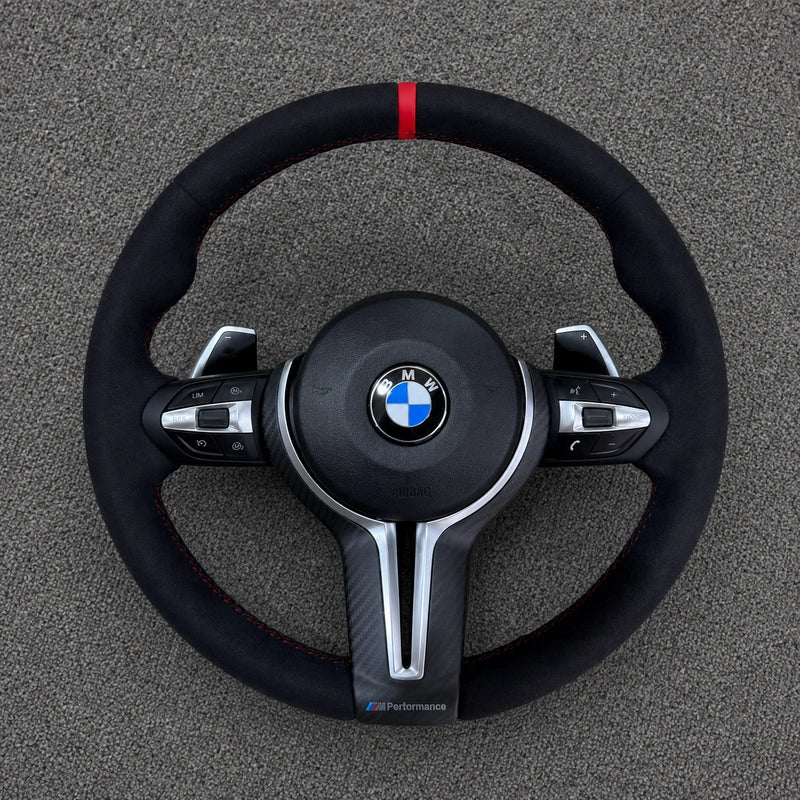 BMW 2 Series black and white carbon fiber steering wheel detail